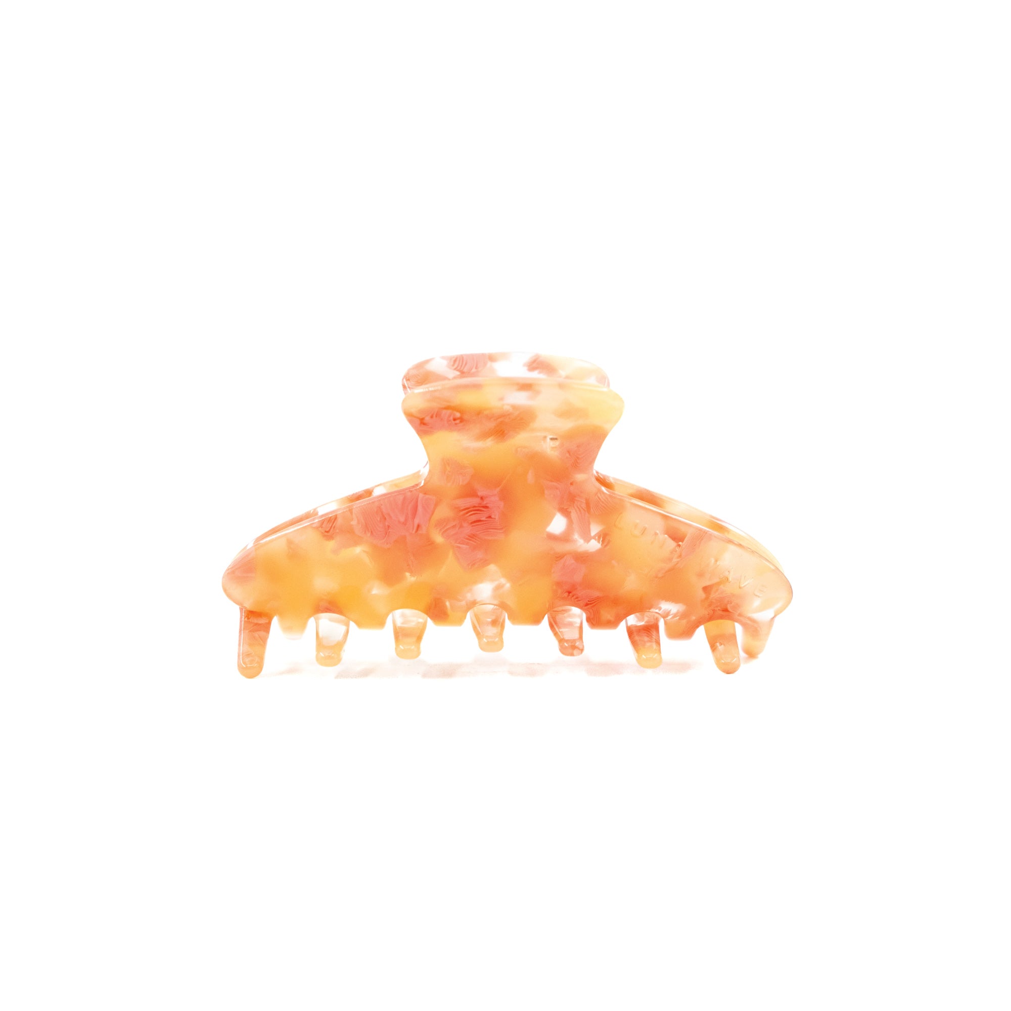 Eco-friendly acetate claw clip in blush coral with warm-toned flecks