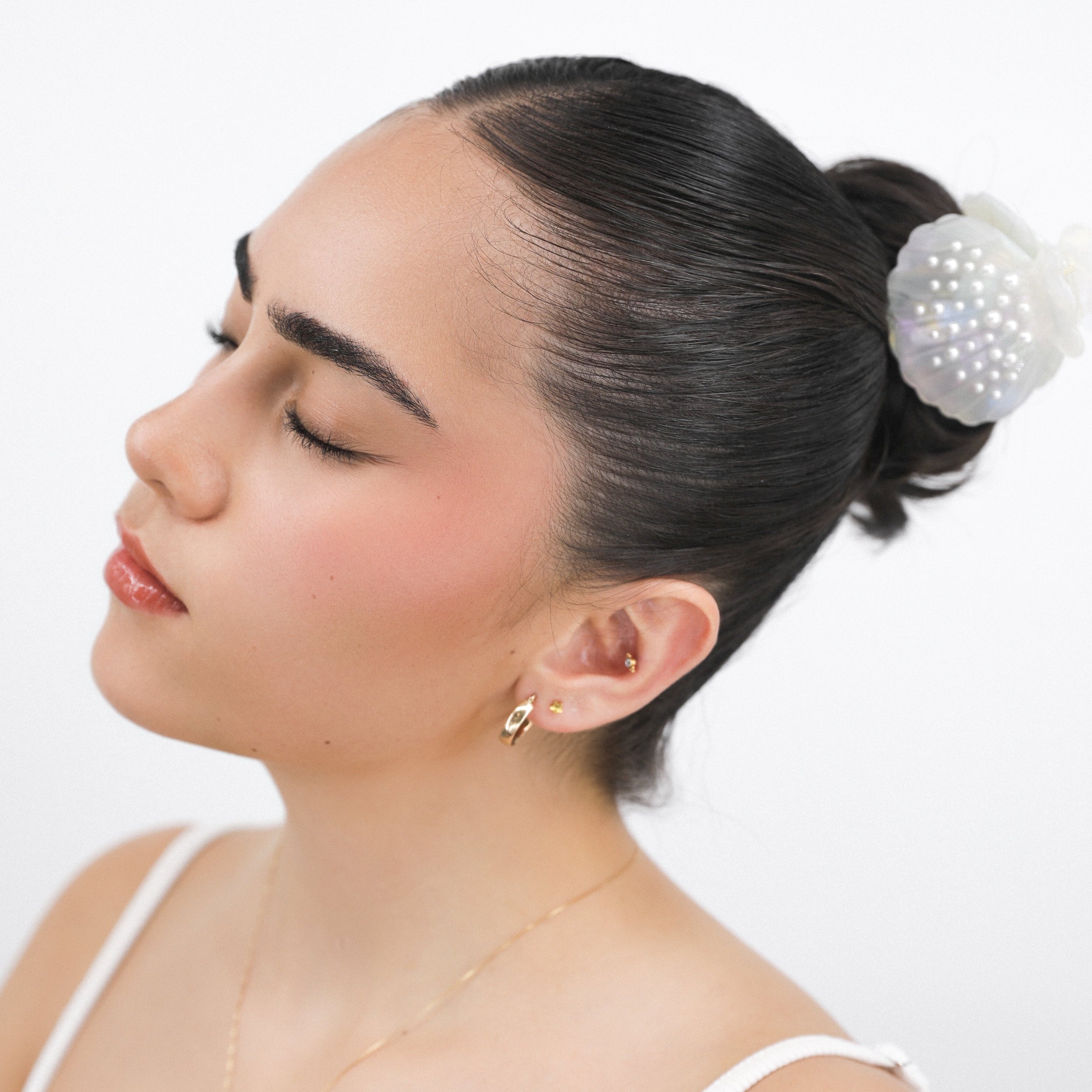 Woman with styled hair and Luna Wave aurelia hair claw clip a white background