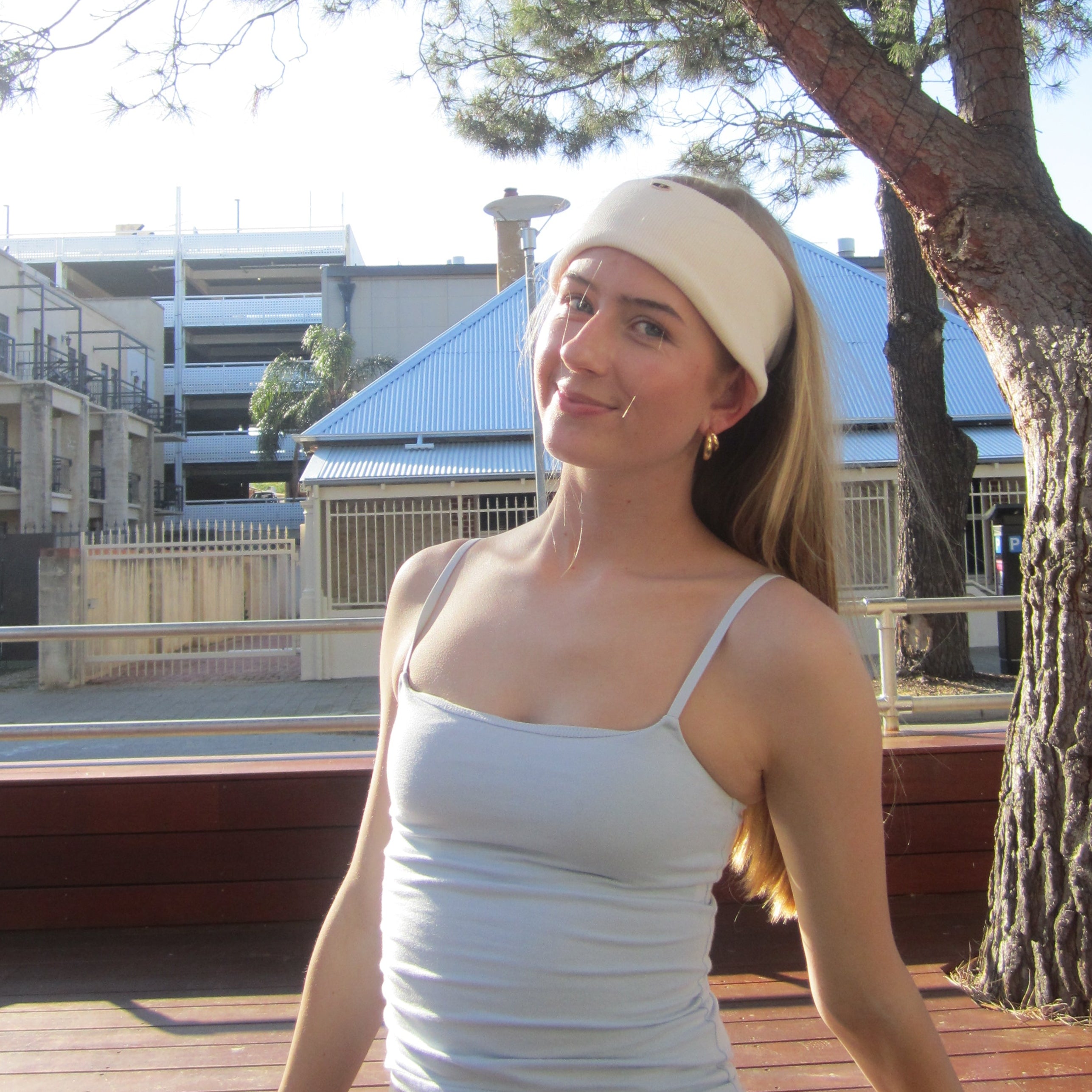 Lady taking a selfie outdoors with luna wave creamy soft headband