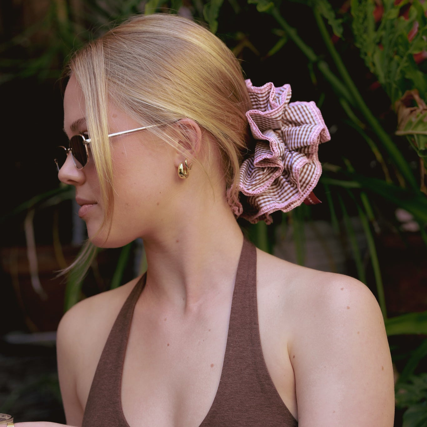 Woman with a luna wave darling duo brown scrunchie