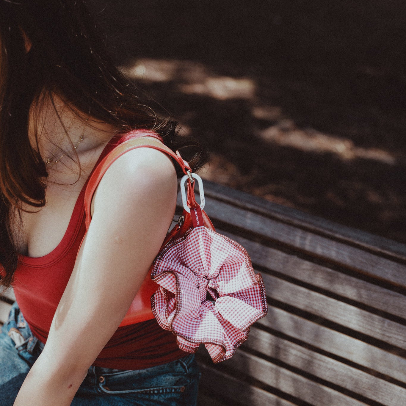 Person sitting on a bench with a luna wave darling-duo 