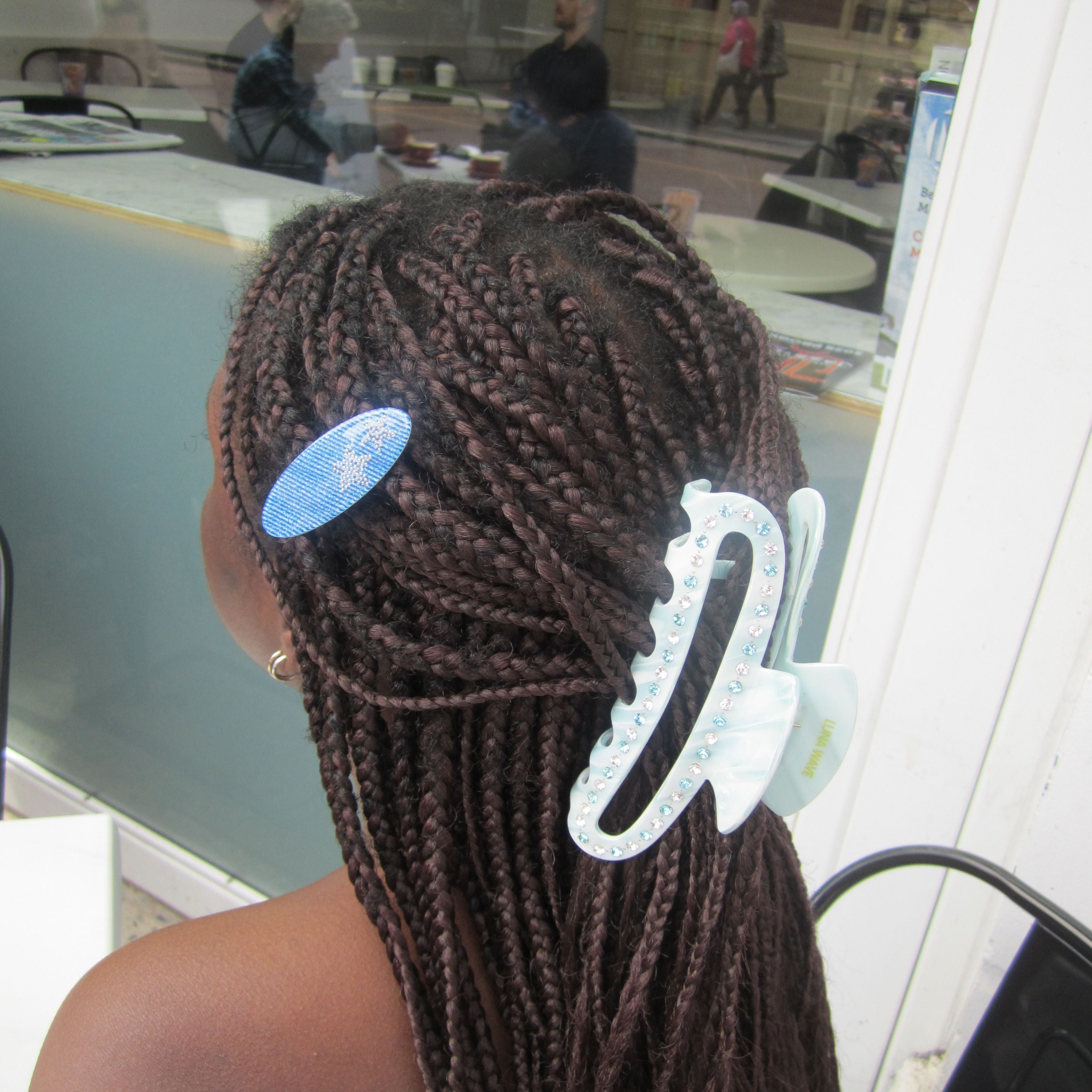 Model with braided hair wearing a Luna Wave ice cloud large claw