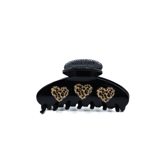 Black claw clip with three leopard-print hearts