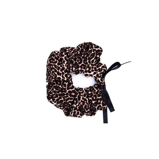 Brown and black leopard-print scrunchie with a small black ribbon bow