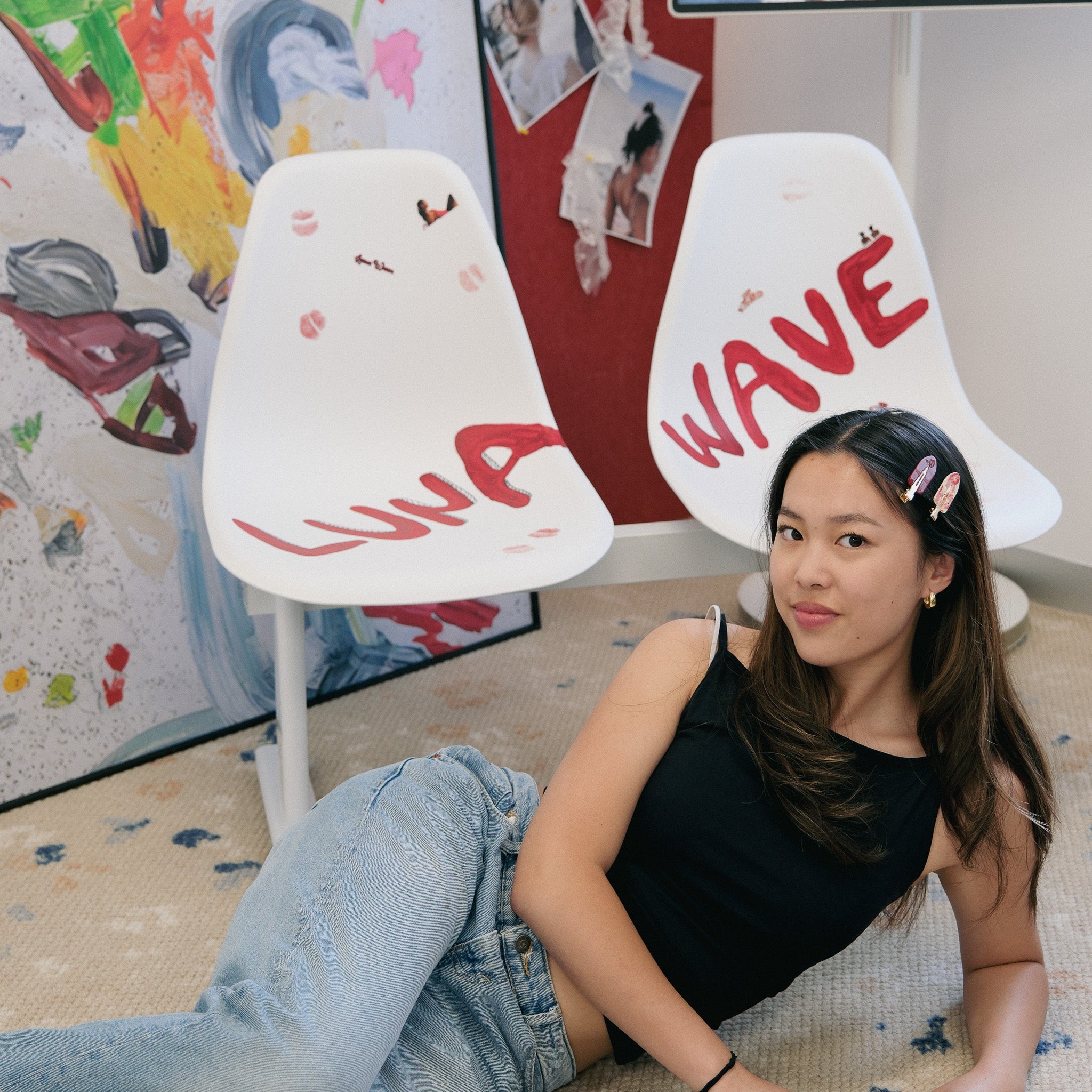 Founder Hamie LYU sitting on the floor with two white chairs behind her, one labeled 'Luna' and the other 'Wave'.