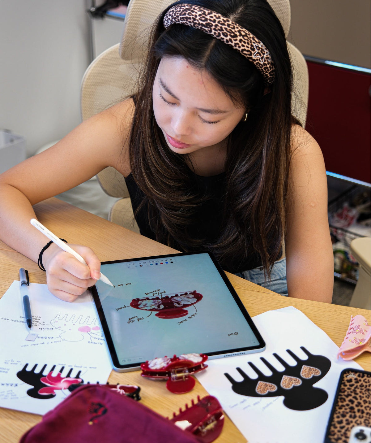 Reviewing sketches for Luna Wave hair accessories