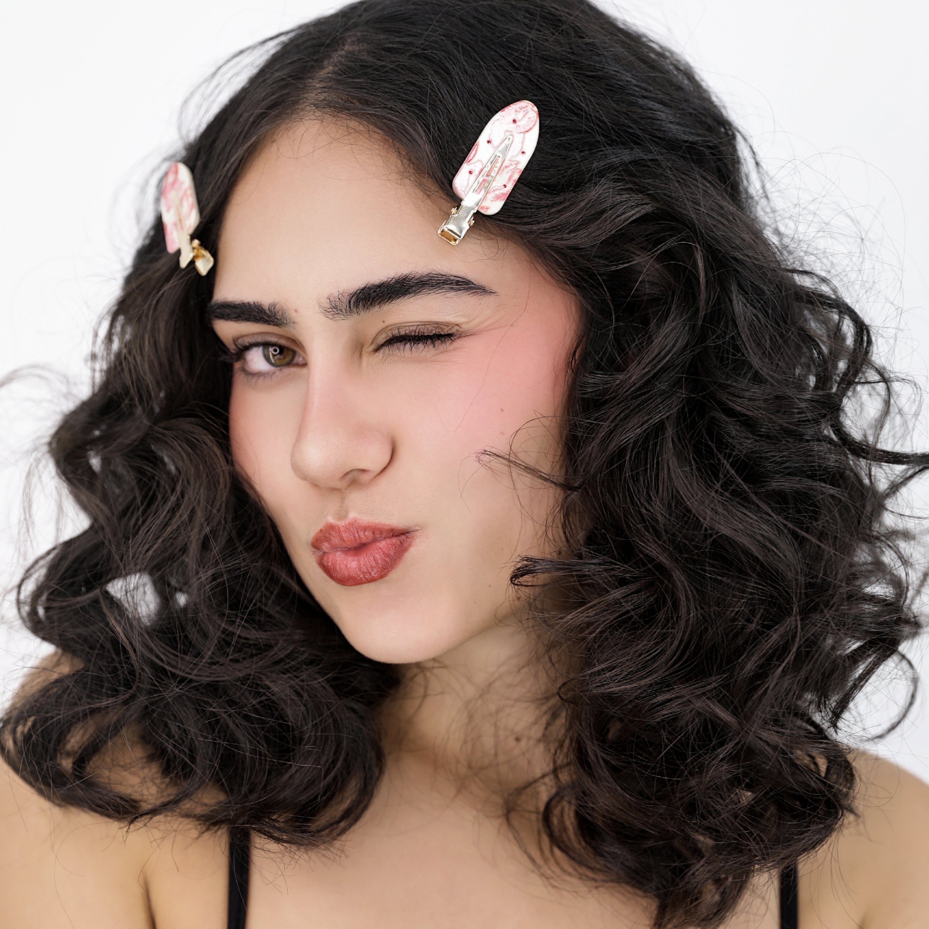 Ali wearing Luna Wave pink rosy hair clips against a white background